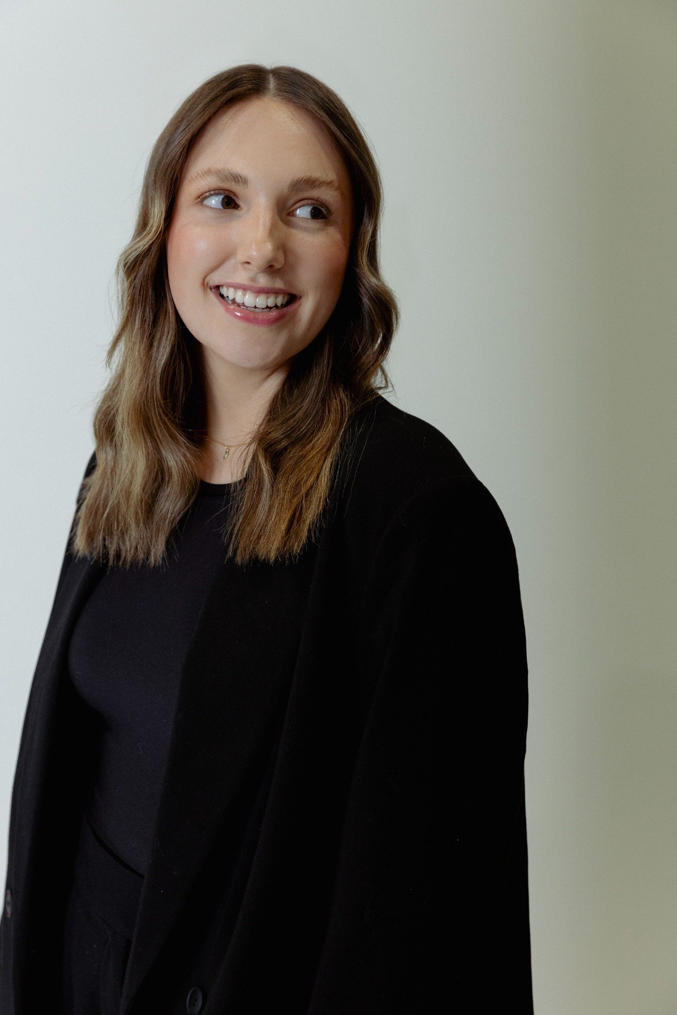 SLENDER WOMAN IN LONG BLACK COAT