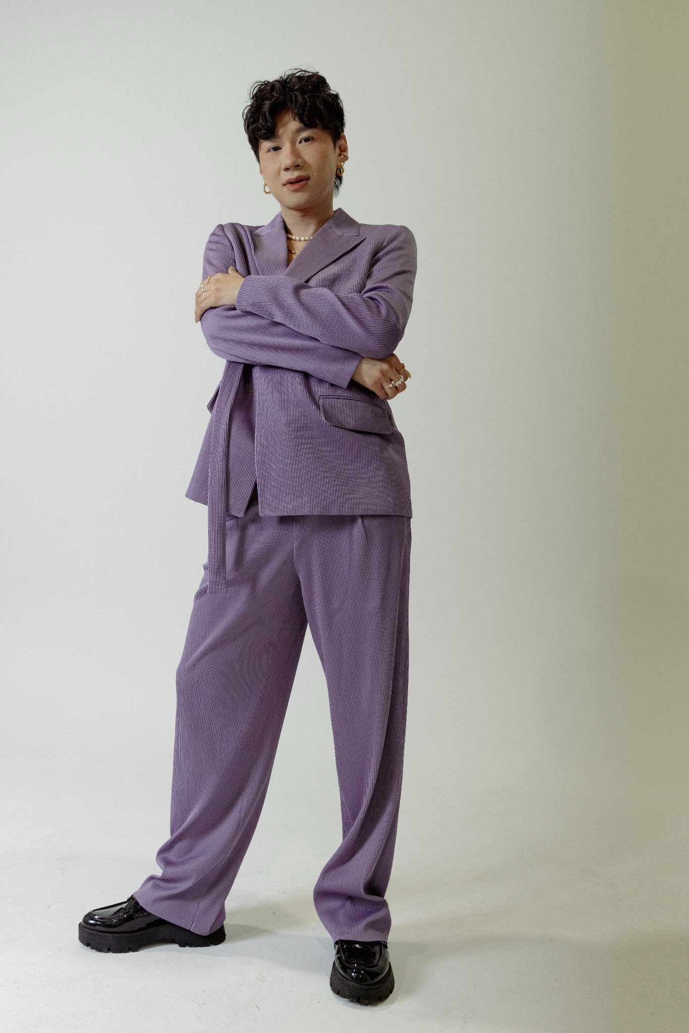 PERSON IN PURPLE SUIT